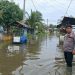 Debit Air Naik hingga 50 Sentimeter, Polsek Tanjung Pura Gerak Cepat Pantau Warga Terdampak Banjir